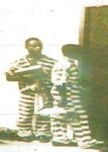 George Stinney walking towards the execution chamber (first from right)