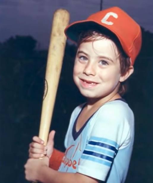 Adam Walsh holding a baseball bat
